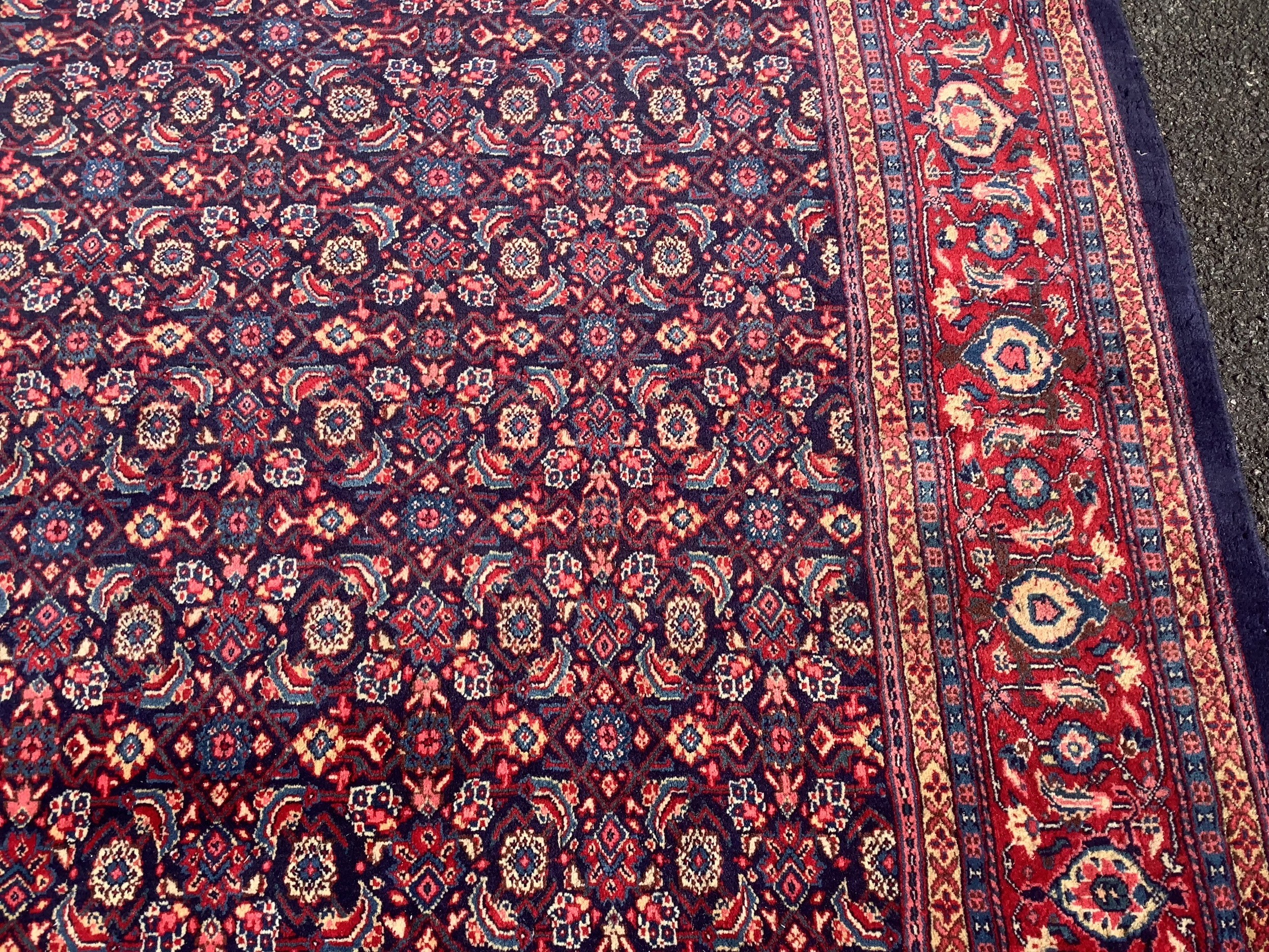 A North West Persian blue ground carpet, 534 x 325cm